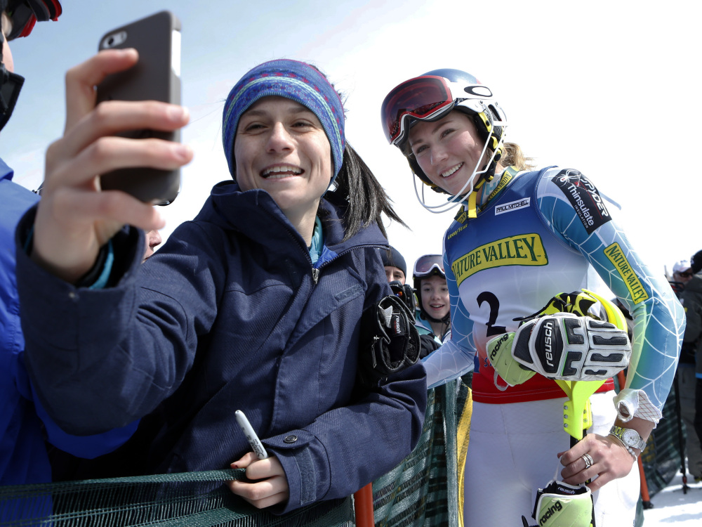 Maria Cavallaro, 14, of North Andover, Mass., snaps a selfie with Mikaela Shiffrin after Shiffrin won the women’s slalom ski race at the U.S. Alpine Championships on Saturday at Sugarloaf Mountain Resort in Carrabassett Valley.