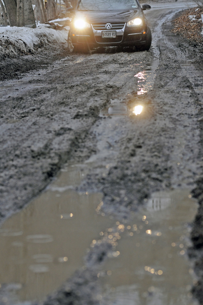 Some dirt roads and driveways, such as this one in Hallowell on Thursday, are in worse shape than others this spring.