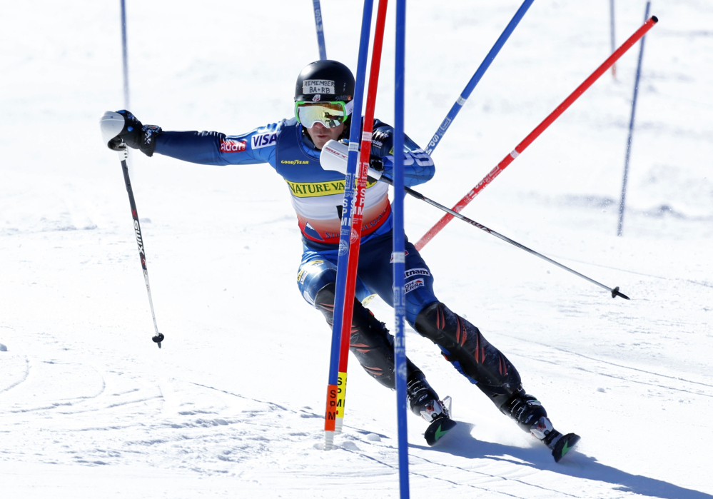 David Chodousky, of Crested Butte, Colo., skis through the gates on his way to winning the men’s slalom ski race at the U.S. Alpine Championships Sunday at Sugarloaf Mountain Resort in Carrabassett Valley.