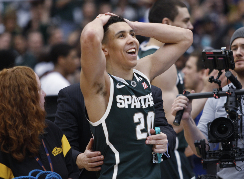 Michigan State’s Travis Trice looks up after the regional final against Louisville in the NCAA men’s college basketball tournament Sunday in Syracuse, N.Y. Michigan State won 76-70.