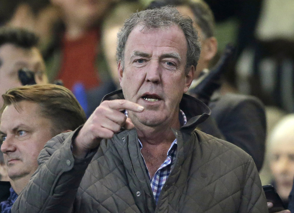 In this Wednesday, March 11, 2015 file photo, TV host Jeremy Clarkson gestures as he takes his place in the stands before the Champions League round of 16 second leg soccer match between Chelsea and Paris Saint Germain at Stamford Bridge Stadium in London.