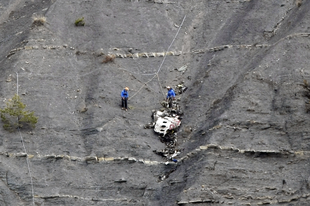 Rescue workers work at the crash site near Seyne-les-Alpes, France, Monday,