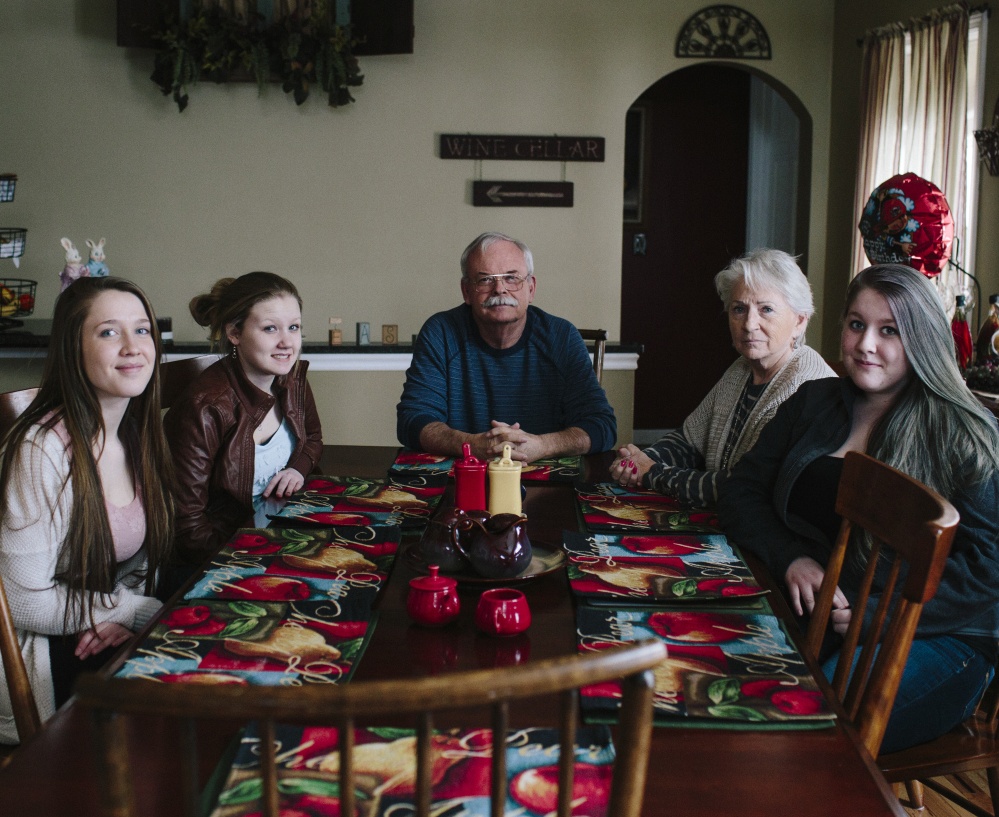 The Farrington family of South China includes foster parent Neil, center, his wife, Doreen, and from left, teenagers Hannah, Ashley and Amanda. The Farringtons have taken in about 75 Maine foster children – mostly teenagers – over the past 20 years.