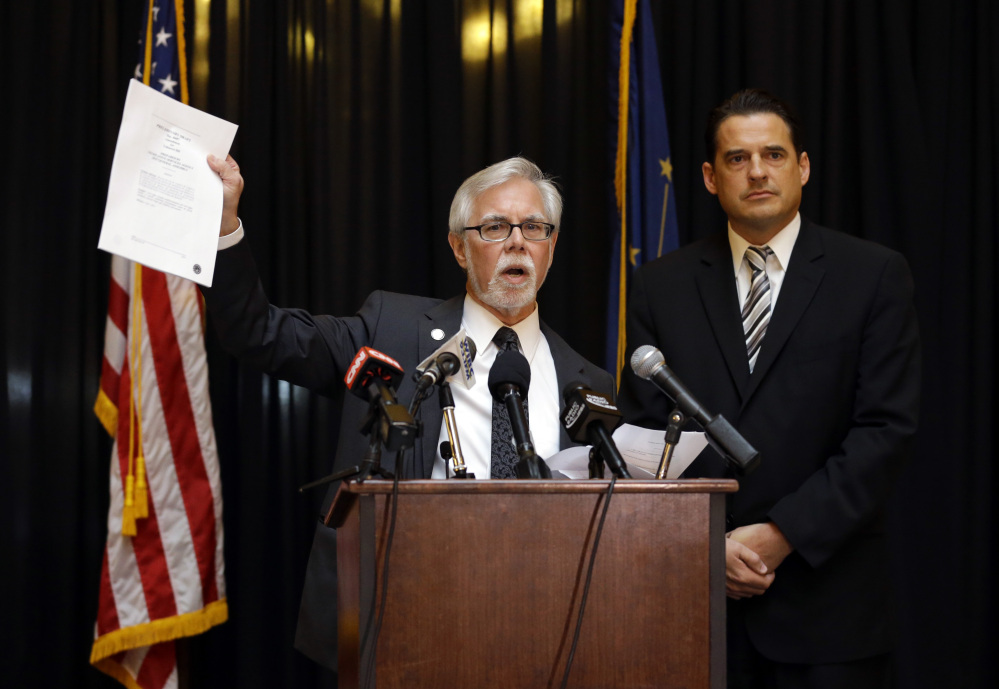 Indiana Senate Democratic Leader Tim Lanane, left, D-Anderson, and Indiana House Democratic Leader Scott Pelath, D-Michigan City, call for the repeal of the Indiana Religious Freedom Restoration Act during a press conference at the Statehouse in Indianapolis, Monday.