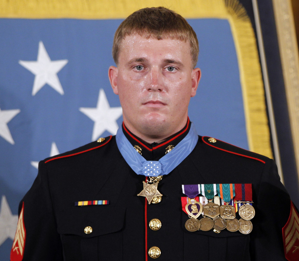 In this Sept. 15, 2011 file photo, former Marine Cpl. Dakota Meyer, 23, from Greensburg, Ky, poses with the Medal of Honor after it was awarded to him by President Barack Obama during a ceremony at the White House in Washington, D.C.
