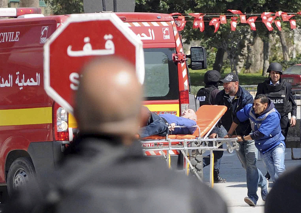 Rescue workers evacuate a victim after gunmen opened fire at the Bardo museum in Tunisia’s capital of Tunis on Wednesday.