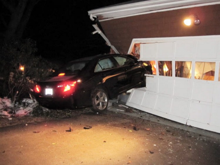 This 2012 Toyota was left lodged in the garage at 295 Summit St. in Portland after its driver hit the building and fled early Wednesday morning.