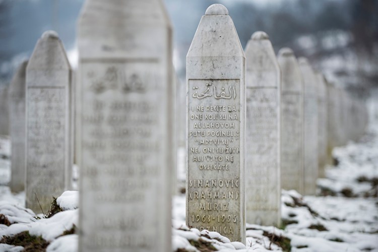 The gravestone of Muriz Sinanovic in the memorial cemetery Potocari, outside Srebrenica.  Sinanovic was among the Muslim Bosniak men and boys killed in July 1995 Srebrenica massacre.
