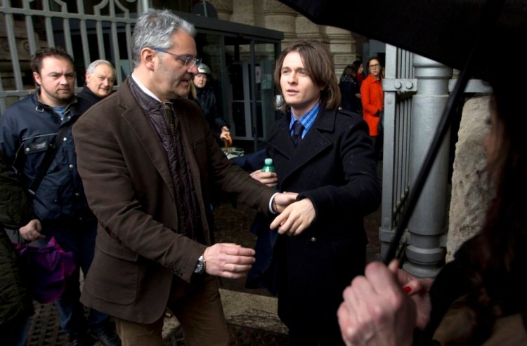 Raffaele Sollecito, right, Amanda Knox's Italian ex-boyfriend, arrives at Italy's highest court in Rome Wednesday to learn their fate when the court hears their appeal of their guilty verdicts in the brutal 2007 murder of Knox's British roommate. The Associated Press