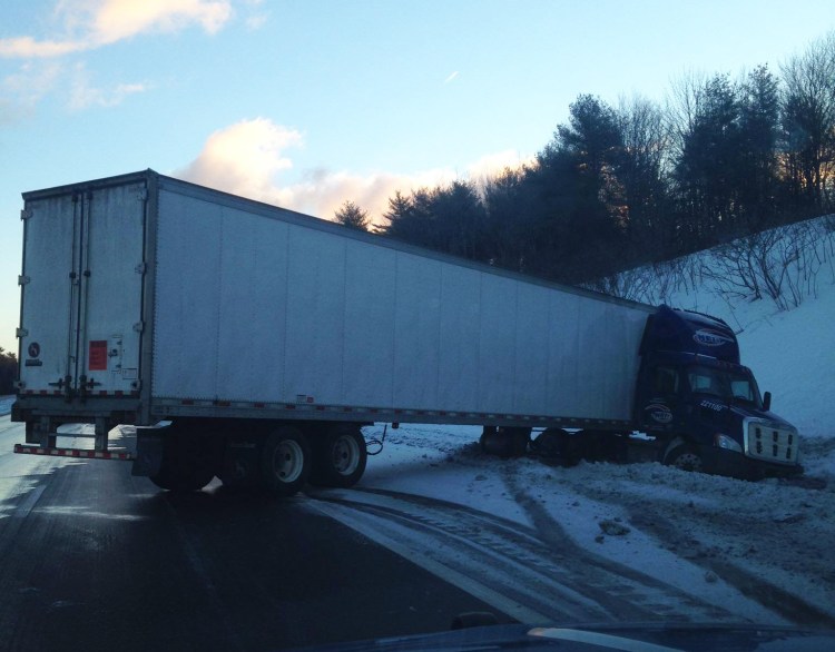 An empty tractor-trailer  truck jackknifed on icy pavement on the northbound lanes of the Maine Turnpike in the area of mile marker #34 on Thursday morning, March 12, 2015. No injuries were reported and no other vehicles were involved. 