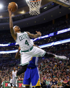 Boston Celtics guard Isaiah Thomas lets go an off-balance shot during the second half of the Golden State Warriors' 106-101 win over in Boston on Sunday. 