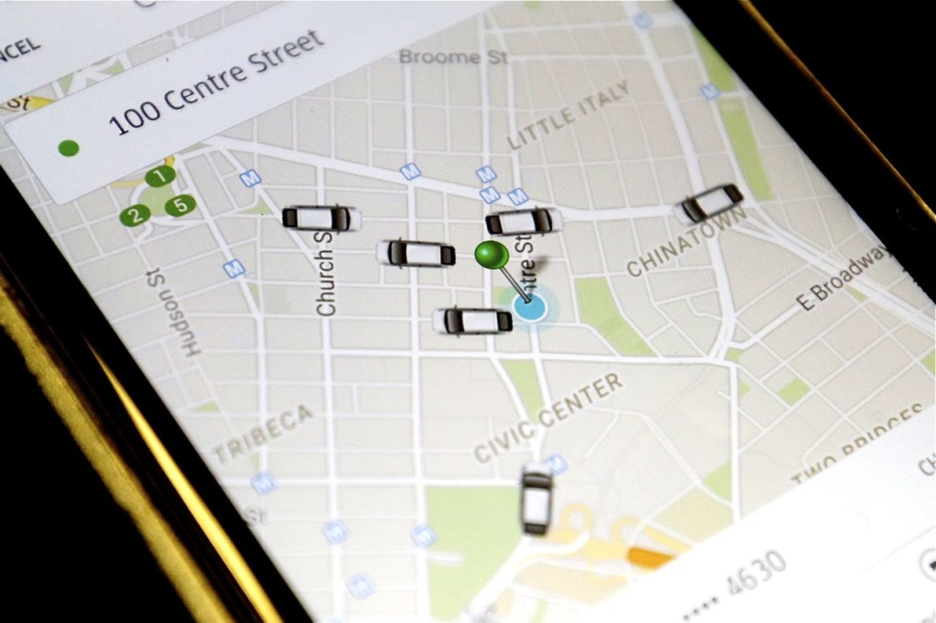 The Uber smartphone app shows the cars available for a pickup in downtown Manhattan Wednesday. The Associated Press