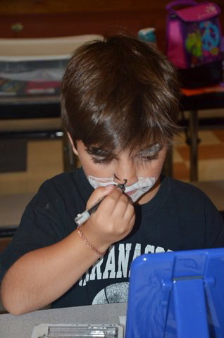 Contributed photo 
 Rocco Scott, of Readfield, working on his character makeup during last summer’s Theatre Arts Day Camp.