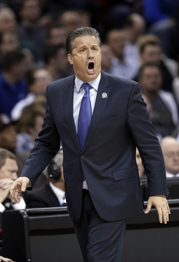 Kentucky coach John Calipari yells at his team during the first half of an NCAA Tournament game against West Virginia last Thursday in Cleveland. Calipari is a polarizing figure in sports.