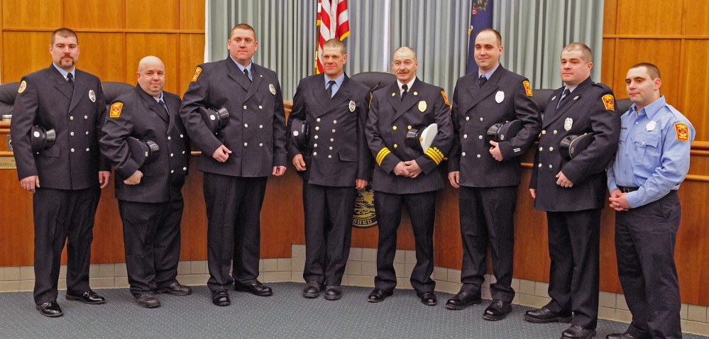 Members of Augusta Fire Department’s C shift were presented with a unit citation for their actions in response to a major fire at 36 Northern Ave. at an Augusta City Council meeting on Thursday in Augusta City Center. Shift members are, from left, Jason McKinnon, James Baldwin, Mic Poirier, Bill Lord, Battalion Chief Steve Leach, Lt. Brian Chamberlin, Dustin Freeman and Nick Whitmore. Poirier also received a Medal of Valor for rescuing a resident.