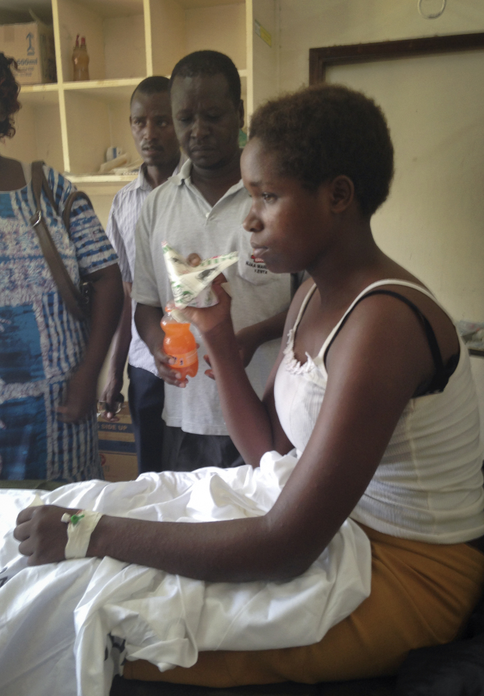 Survivor of the killings at Garissa University College Cynthia Cheroitich, 19, who was found on Saturday two days after the attack, drinks some milk in a hospital ward in Garissa, Kenya.