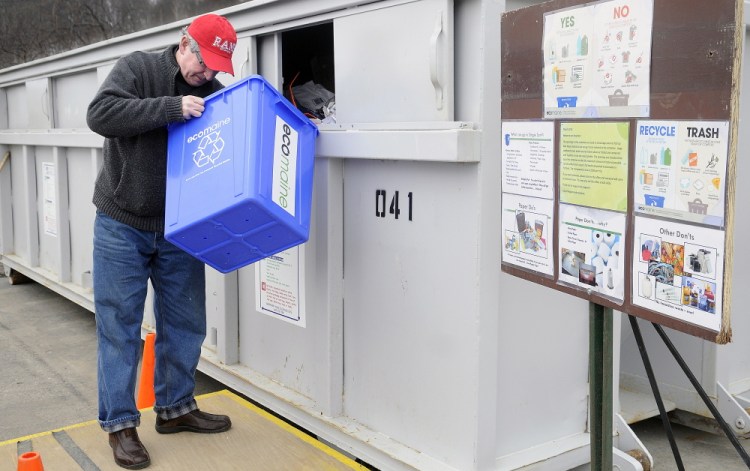 Superior Court Justice and former Augusta Mayor Bill Stokes recycles items Thursday at the recycling station at Augusta Public Works.