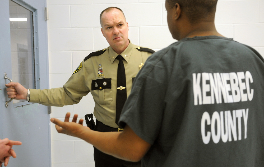 Kennebec County Sheriff Randall Liberty confers with an inmate Thursday at the Kennebec County Correctional Facility in Augusta. Liberty has asked local police departments to use wider discretion in arresting people amid overcrowding concerns at the county jail in Augusta.