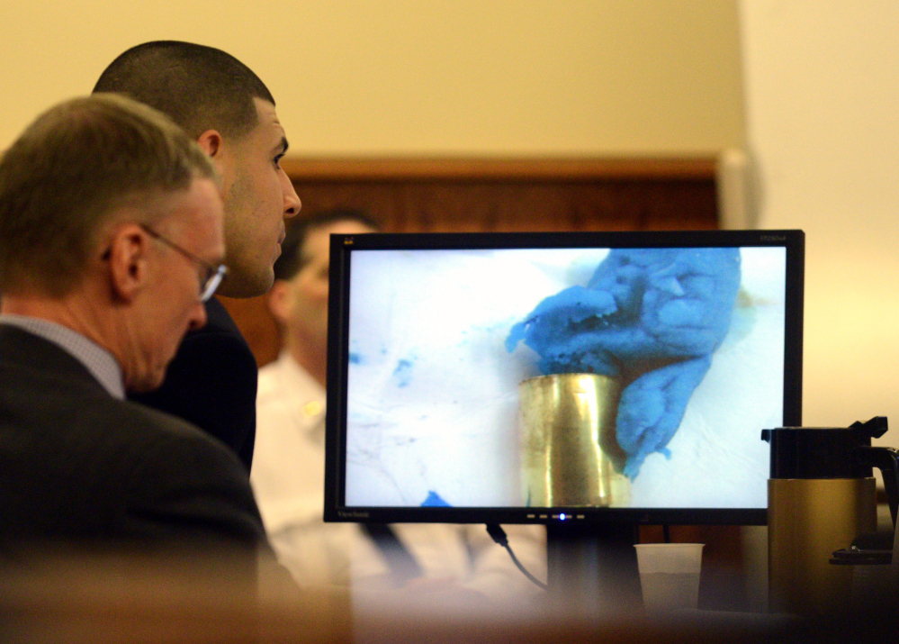 Prosecutors say Aaron Hernandez’s DNA was found on a shell casing. The defense says the DNA came from the blue bubblegum, not from the defendant handling bullets.