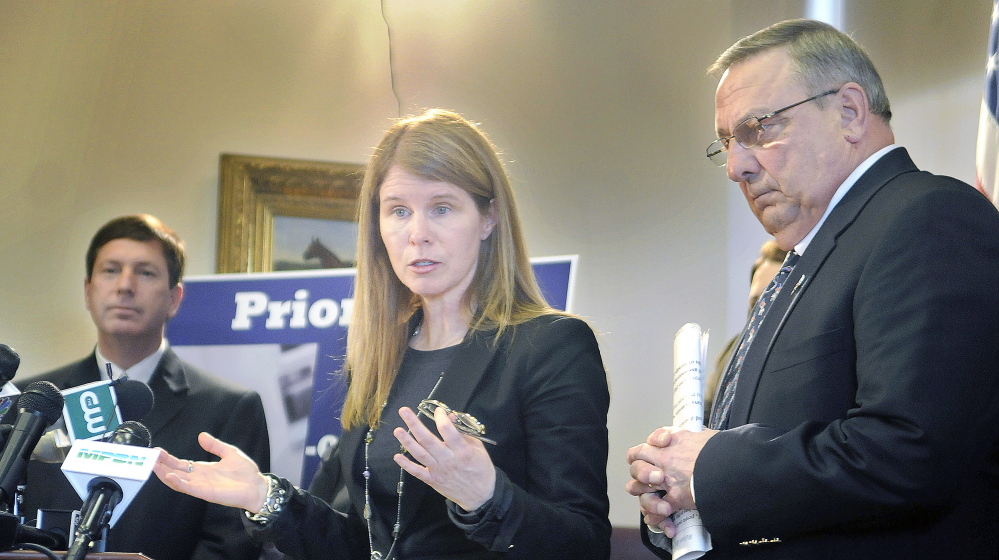 Mary Mayhew, commissioner of the Department of Health and Human Services, discusses a package of legislative proposals submitted by the administration to make changes to the Temporary Assistance for Needy Families program at a news conference Monday in Augusta with Gov. Paul LePage and House minority leader Rep. Ken Fredette, R-Newport.