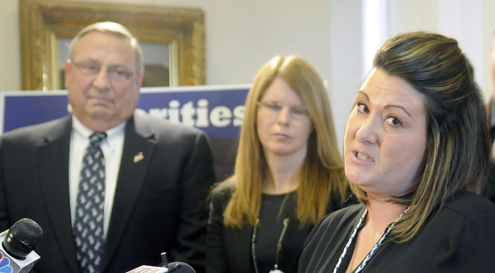Former Temporary Assistance for Needy Families recipient Danielle Dorward expresses support for reforming the program with Gov. Paul LePage and Mary Mayhew, commissioner of the Department of Health and Human Services, at a press conference Monday in Augusta. Rothrock now works at DHHS.
