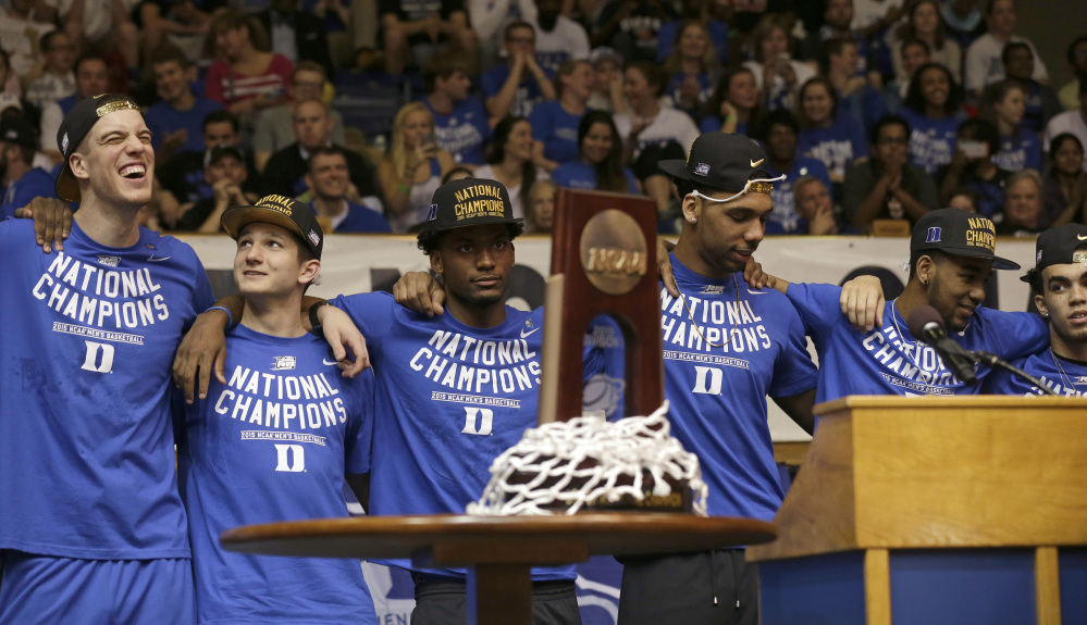 Members of the national championship Duke basketball team from left, Marshall Plumlee; Grayson Allen; Justise Winslow; Jahlil Okafor; Matt Jones and Tyrus Jones are welcomed at Cameron Indoor Stadium Tuesday in Durham, N.C. Duke defeated Wisconsin Monday night in the NCAA Final Four tournament championship game.