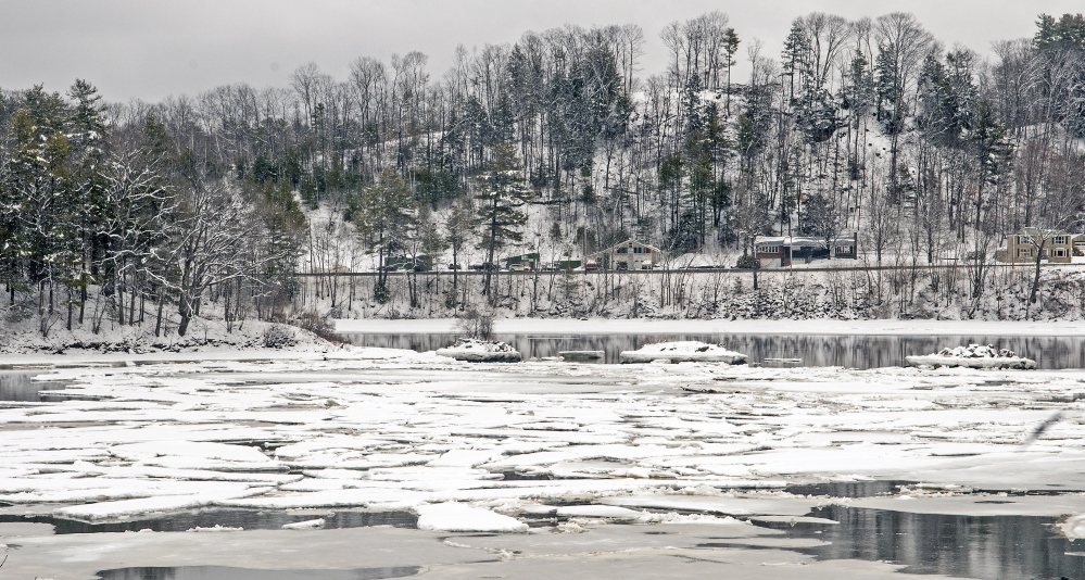 Ice floats downstream past Browns Island on Thursday on the Kennebec River between Randolph and Farmingdale.