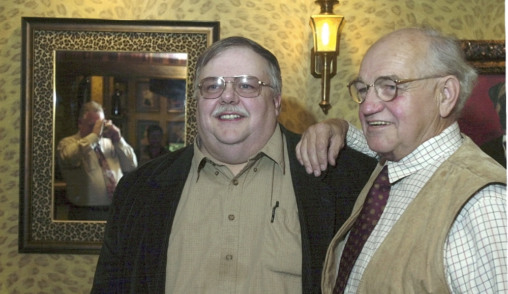 Actor Richard Dysart, right, poses for a photo with Augusta businessman Roger Pomerleau at the Senator Inn in 2003 as Wayne Mitchell (reflected in the mirror) takes a picture of the pair. Dysart, who died Sunday at 86, lived in Augusta and graduated from Cony High School.