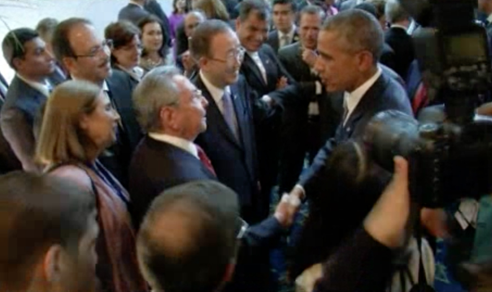 U.S. President Barack Obama and Cuban President Raul Castro exchange handshakes on Friday at the opening of the Summit of the Americas in Panama. The two are expected to meet on Saturday.