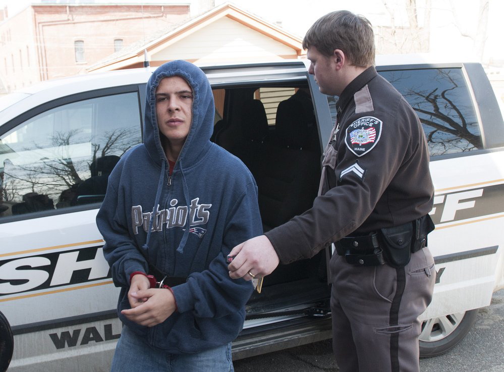 Colby Hodgdon, 16, is led to Waldo County District Court in Belfast on Friday, April 3. He is accused of killing his father, Steven Hodgdon, in Troy in March.