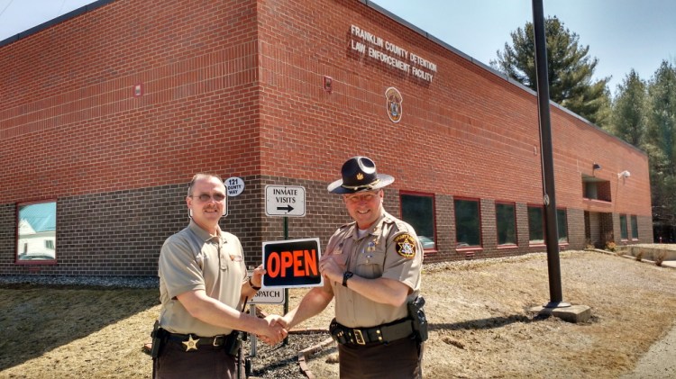 Jail Administrator Doug Blauvelt, left, and Franklin County Sheriff Scott Nichols, right, stand in front of the newly relicensed Franklin County Detention Center. The jail, which was reduced to a 72-hour holding facility, is now allowed to fully operate and to board inmates.