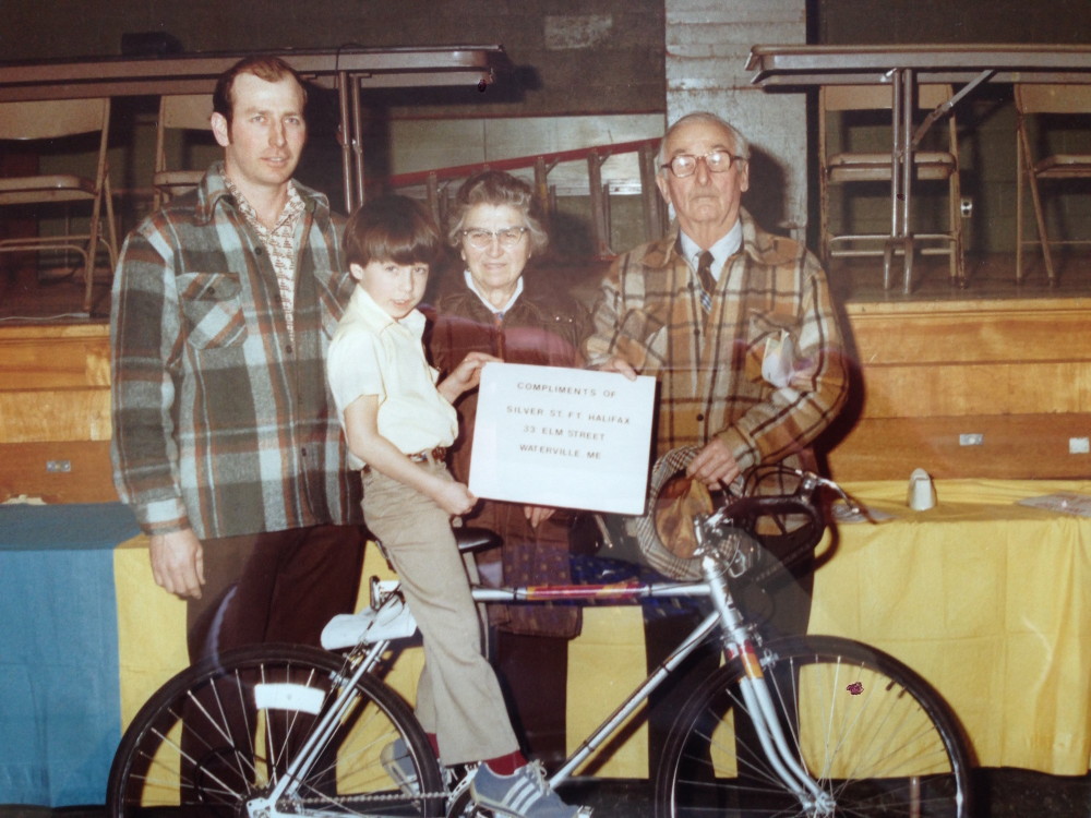 In a photo taken in 1980, Ryan Poulin, 7 years old at the time, poses after winning a new bicycle after winning a credit union contest. He is surrounded by his father Gerald Poulin, at left, and his late grandparents, Alfred and Desange Poulin.