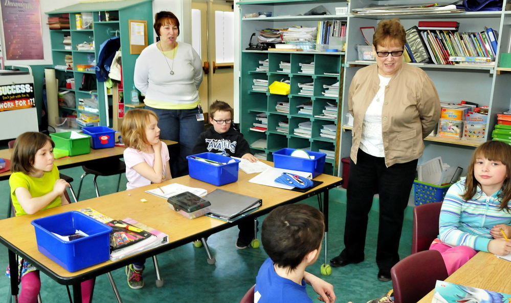Staff photo by David Leaming
Longtime SAD 13 educator Linda Hunnewell, right, visits the second grade classroom where she once taught at Moscow Elementary on Thursday. Next to her is her daughter, Wendy Belanger, who teaches at the school.
