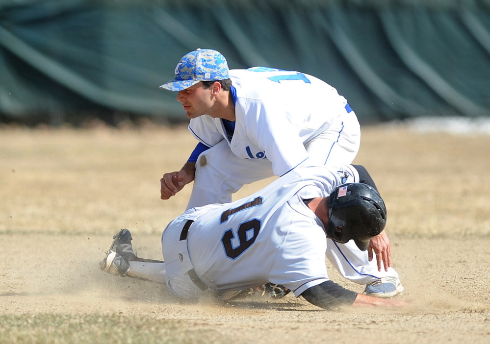 Colby College shortstop Tommy Forese (14) tags out Tufts University’s Matt Moser (19) at second base in the second inning Friday at Colby College in Waterville.