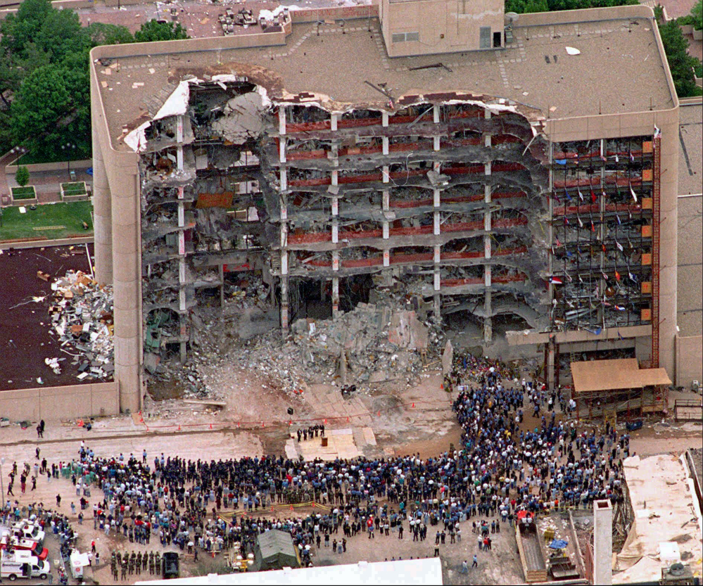 In this May 5, 1995 file photo, a large group of search and rescue crew attends a memorial service in front of the Alfred P. Murrah Federal Building in Oklahoma City.