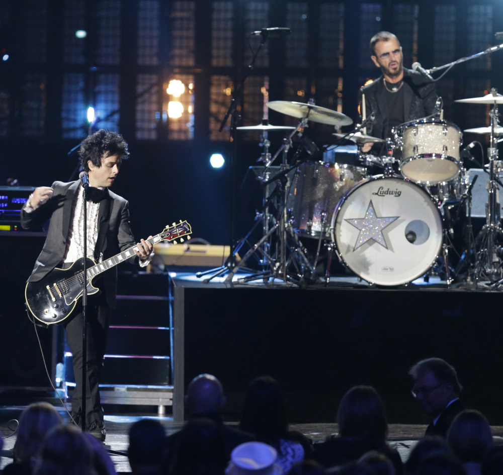 Ringo Star and Billie Joe Armstrong, from Green Day, perform at the Rock and Roll Hall of Fame Induction Ceremony Saturday night in Cleveland.