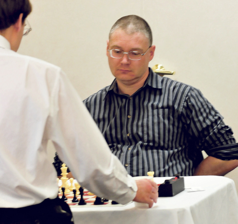 Maine Closed Chess Championship winner Jarod Bryan plays against Aaron Spencer on Sunday.