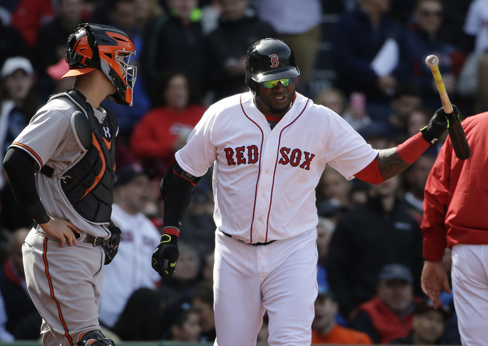 Boston’s David Ortiz, right, throws his bat after being ejected from a game as Baltimore’ Caleb Joseph, left, looks on during the fifth inning Sunday in Boston.