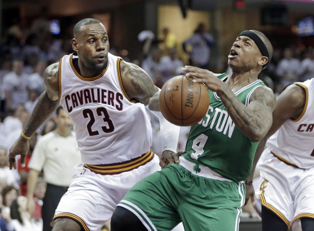 AP photo
Boston’s Isaiah Thomas (4) loses the ball after a foul by Cleveland’s LeBron James (23) in the second quarter of a first-round playoff game Sunday in Cleveland.