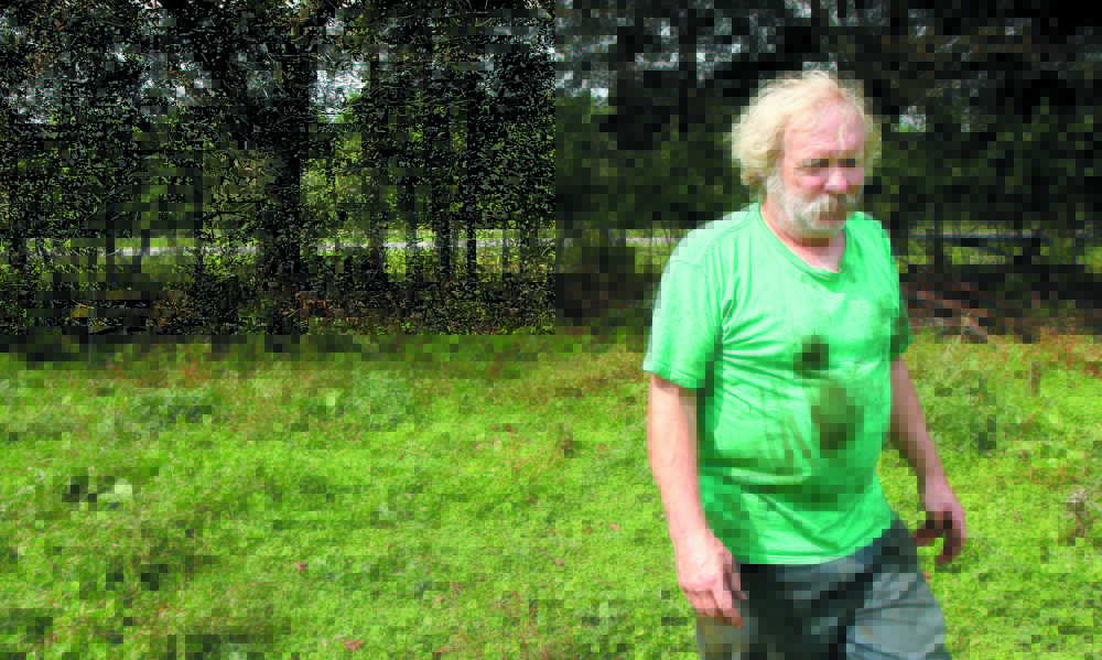 Farmer Mark Gould, seen in this 2011 photo, owns farm property that abuts Interstate 95 in Sidney. He is facing complaints that he’s not properly disposing of dead animals on his property.
