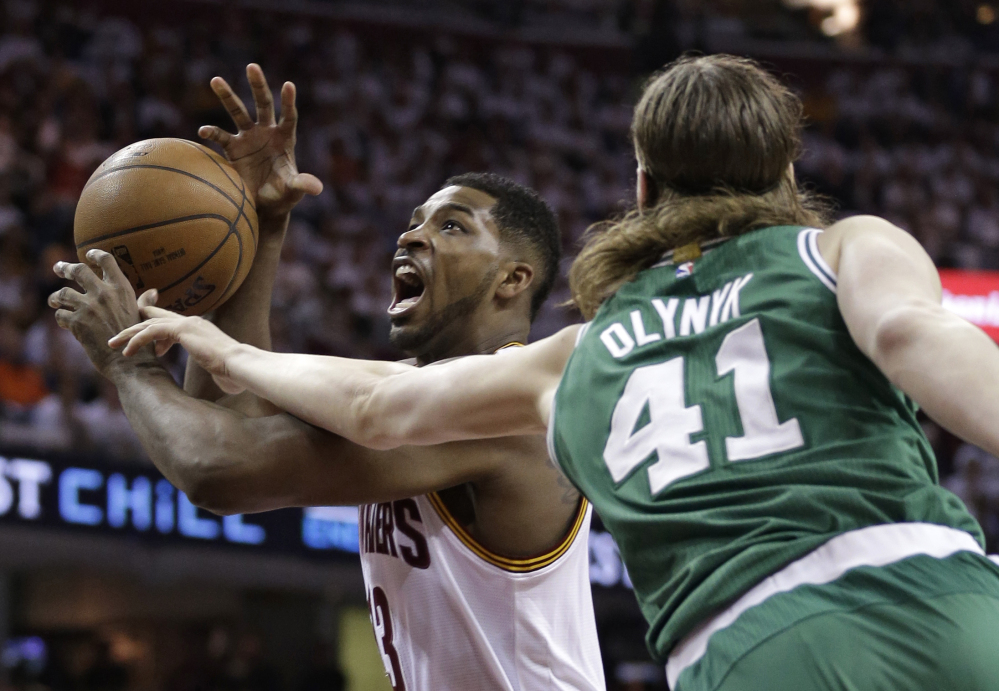 Cleveland Cavaliers’ Tristan Thompson (13) drives to the basket against Boston Celtics’ Kelly Olynyk (41) during the first round of the NBA playoffs Sunday in Cleveland. The “Big 3” garner all the hype and headlines, but the Cavaliers are much more than LeBron James, Kyrie Irving and Kevin Love. Cleveland’s bench came through in Game 1 against Boston as reserves Thompson and James Jones made huge contributions in the 113-100 win.