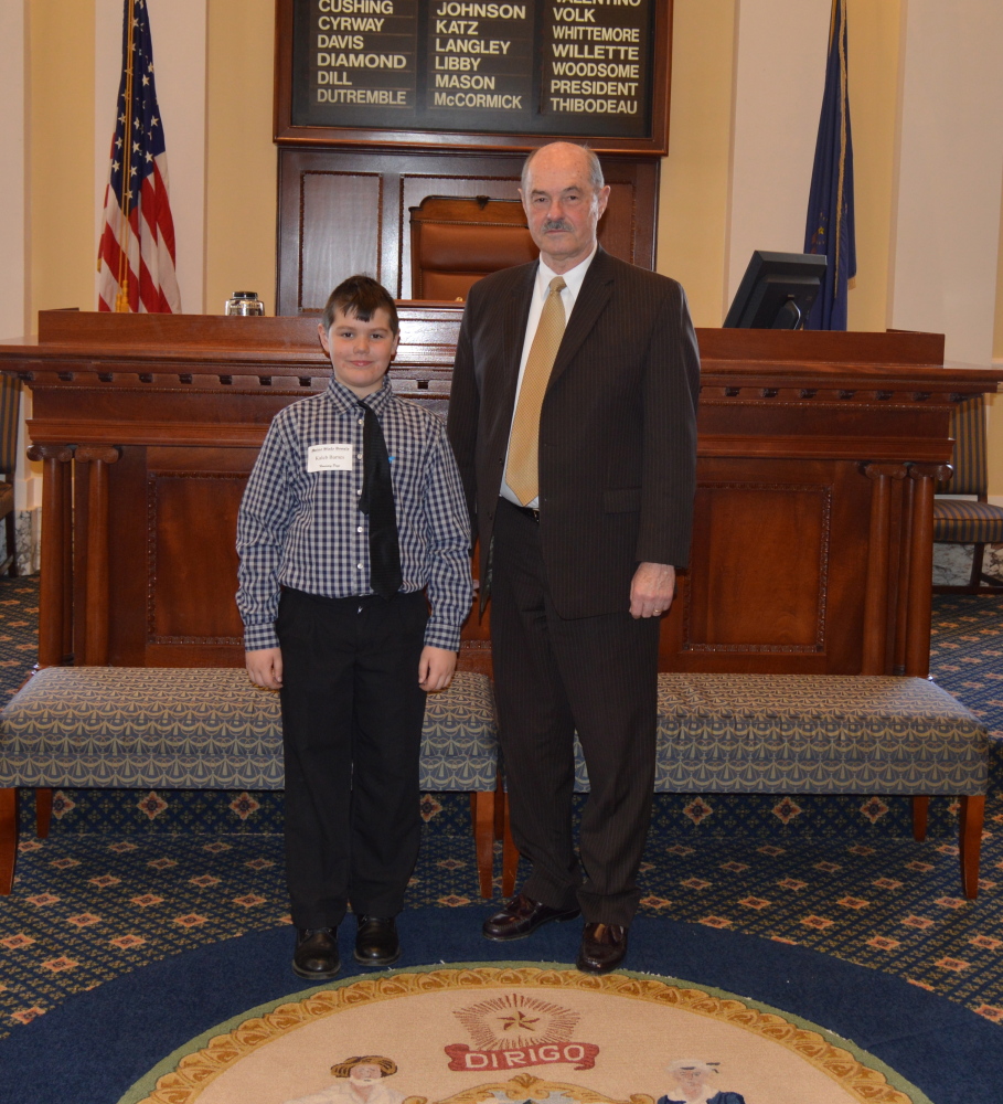 Kaleb Barnes, of Pittston, left, a student at Chop Point School in Woolwich, recently served as an Honorary Page for the March 25 session where he assisted in delivering messages to the senators along with helping the chamber staff perform their daily duties. Kaleb was welcomed to the Statehouse by Sen. Earle McCormick, R-West Gardiner. The student also was accompanied by his chaperones Sheila Frankonis and Angelic Saraydarian.