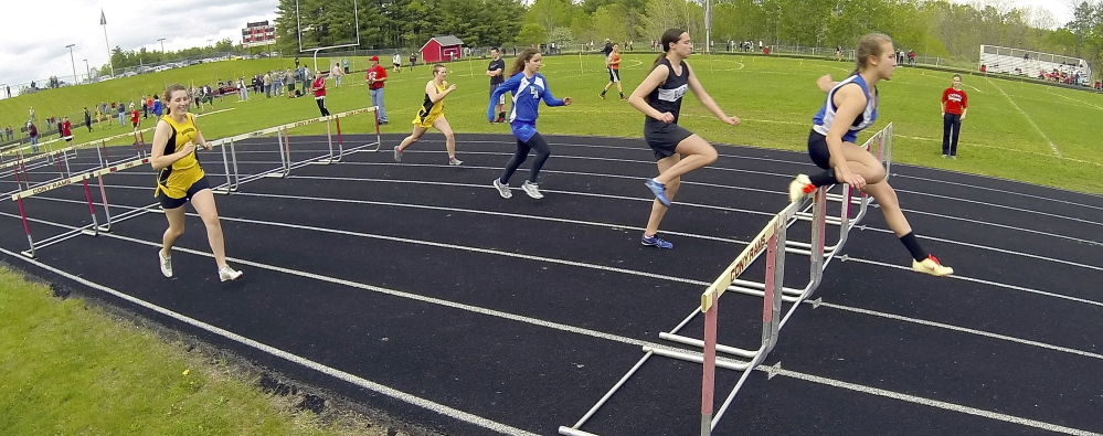 Erskine Academy hurdler Micheala Sprague leads her heat in the 100-meter hurdles during the Capital City Classic at Cony High’s Alumni Field in Augusta last May. The Elsie and William Viles Foundation is donating $250,000 to improve Alumni Field.