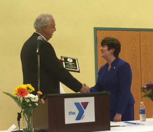 Harry Lanphear, Kennebec Valley YMCA board president, left, presents The Mike Seitzenger Director of the Year Award to Mary Hammond, KVYMCA board secretary.