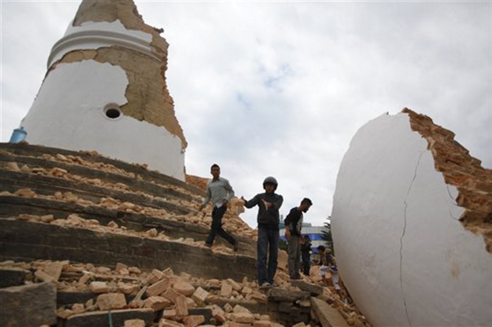 Volunteers work to remove debris at the historic Dharahara tower, a city landmark, after an earthquake in Kathmandu, Nepal, on Saturday.