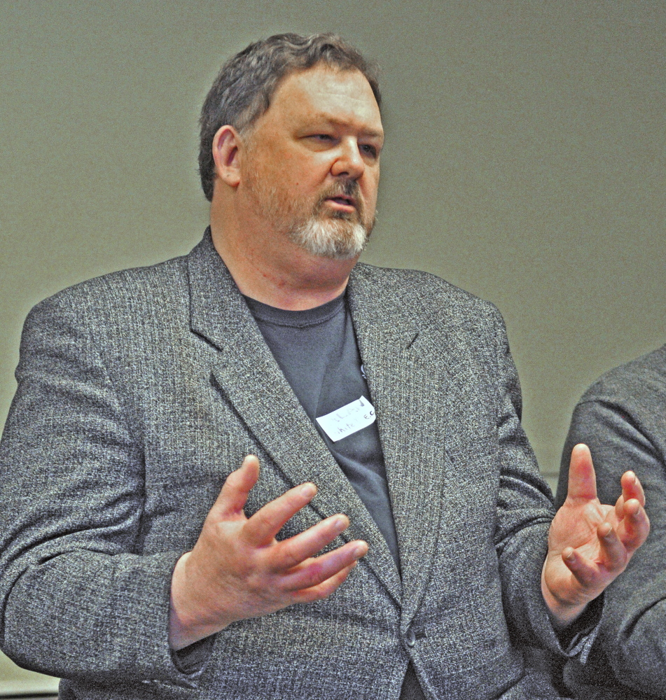 Alan White talks about the Island Employees Cooperative during a conference on business cooperatives Saturday at the Viles Arboretum in Augusta.