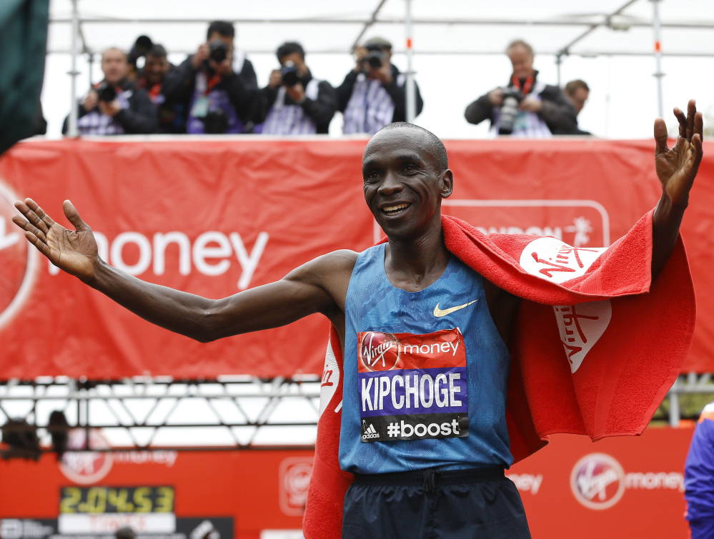 Eliud Kipchoge of Kenya celebrates after he wins the Men’s race in the 35th London Marathon on Sunday.