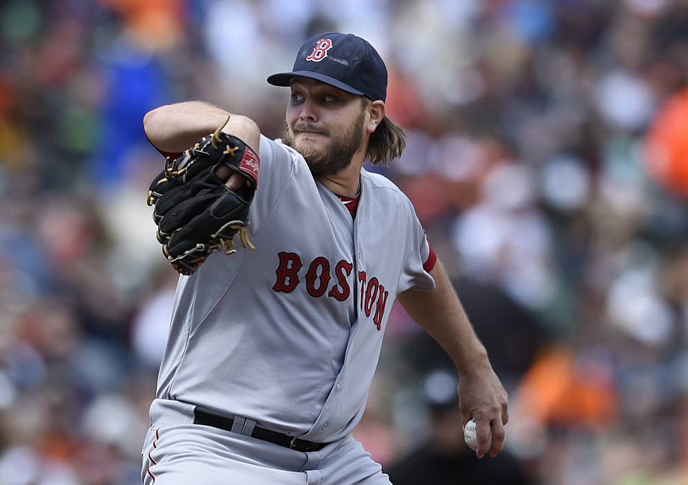 Boston’s Wade Miley delivers a pitch against Baltimore in the first inning Sunday in Baltimore. Miley allowed six earned runs on five hits in 2   innings.