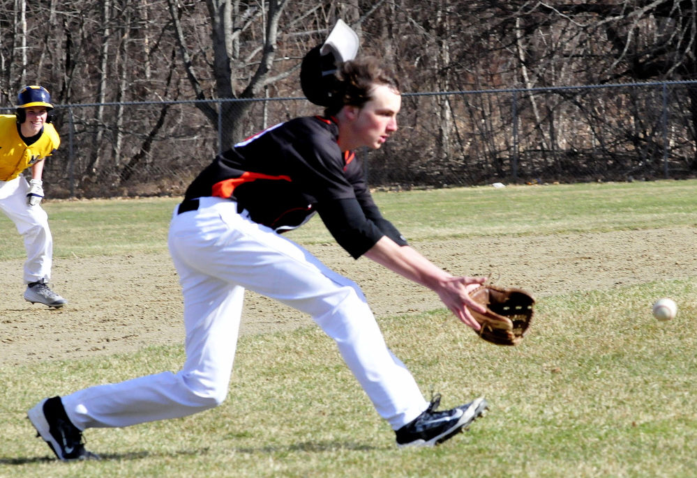 Skowhegan’s Mike Berry loses his hat attempting to grab a line drive during a Kennebec Valley Athletic Conference Class A game Monday in Farmington.