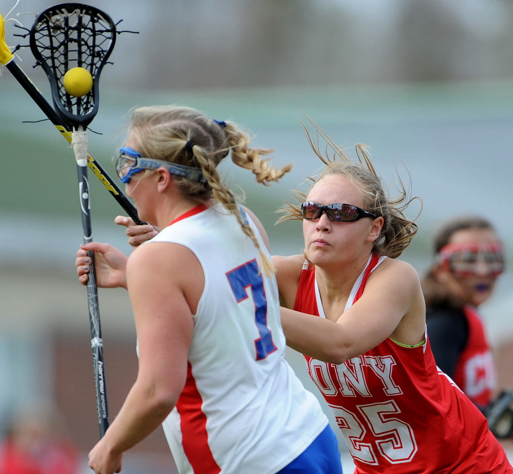 Cony’s Samantha Akers (25) defends against Messalonskee’s Lydia Dexter (7) in the second period Tuesday in Oakland.